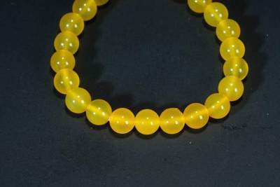 上海都达杂项专场三十四【年后发货全场包邮】  天然黄玛瑙0.8圆珠手串 附鉴定证书86-330