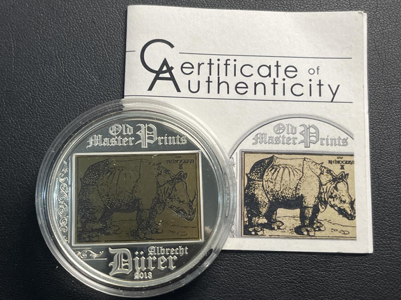 ❤️【币观天下】❤️ 第340期钱币拍卖- 2026.1.23周五晚上6点半场-长期征集拍品 带证书（出厂无外包装盒）库克2013年名作《丢勒的犀牛》镶嵌铜版蚀刻画精制银币925银重20克直径38.61毫米发行量2500枚