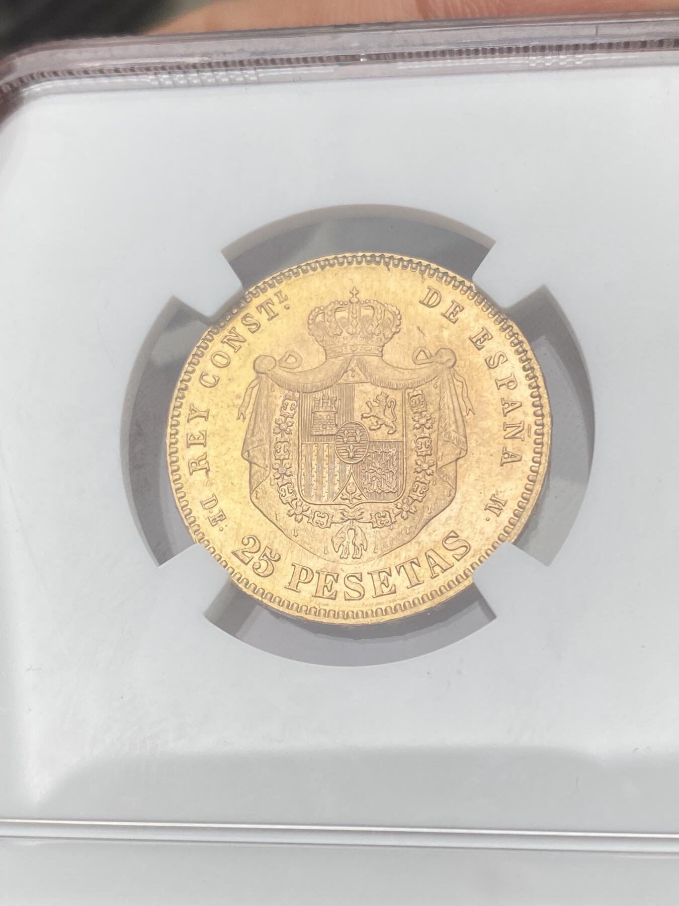 万国钱币拍卖第059期 NGC MS66 1878西班牙阿方索十二世25比塞塔金币 大量进入流通的西班牙金币品种 GEM级别可谓难得一见 丝绸金光类镜面质感 肉眼无暇状态 堪称完美的顶级典藏品质 8.06g 900金