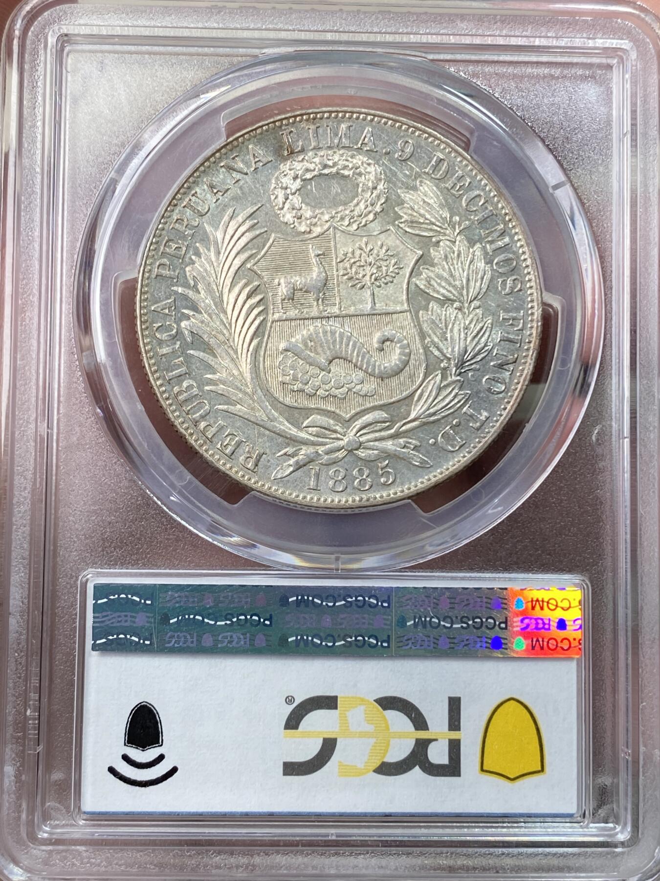 万国钱币拍卖第059期 PCGS MS62 1885年秘鲁坐人女神1索尔大银 深打转光收藏级品质
