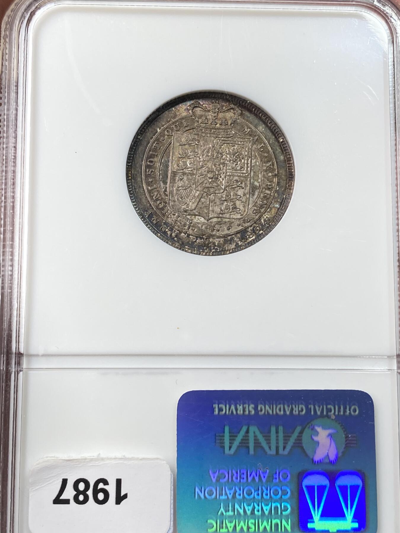 万国钱币拍卖第059期 NGC MS64 1824年英国乔治四世嘉德1先令银币 原味英式天鹅绒七色浓郁包浆 NGC老白盒难得收藏品质