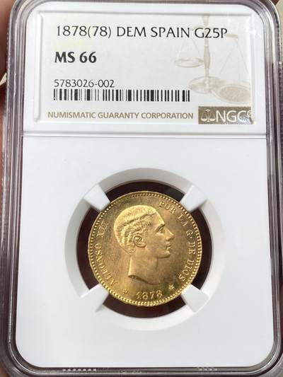 万国钱币拍卖第059期 - NGC MS66 1878西班牙阿方索十二世25比塞塔金币 大量进入流通的西班牙金币品种 GEM级别可谓难得一见 丝绸金光类镜面质感 肉眼无暇状态 堪称完美的顶级典藏品质 8.06g 900金
