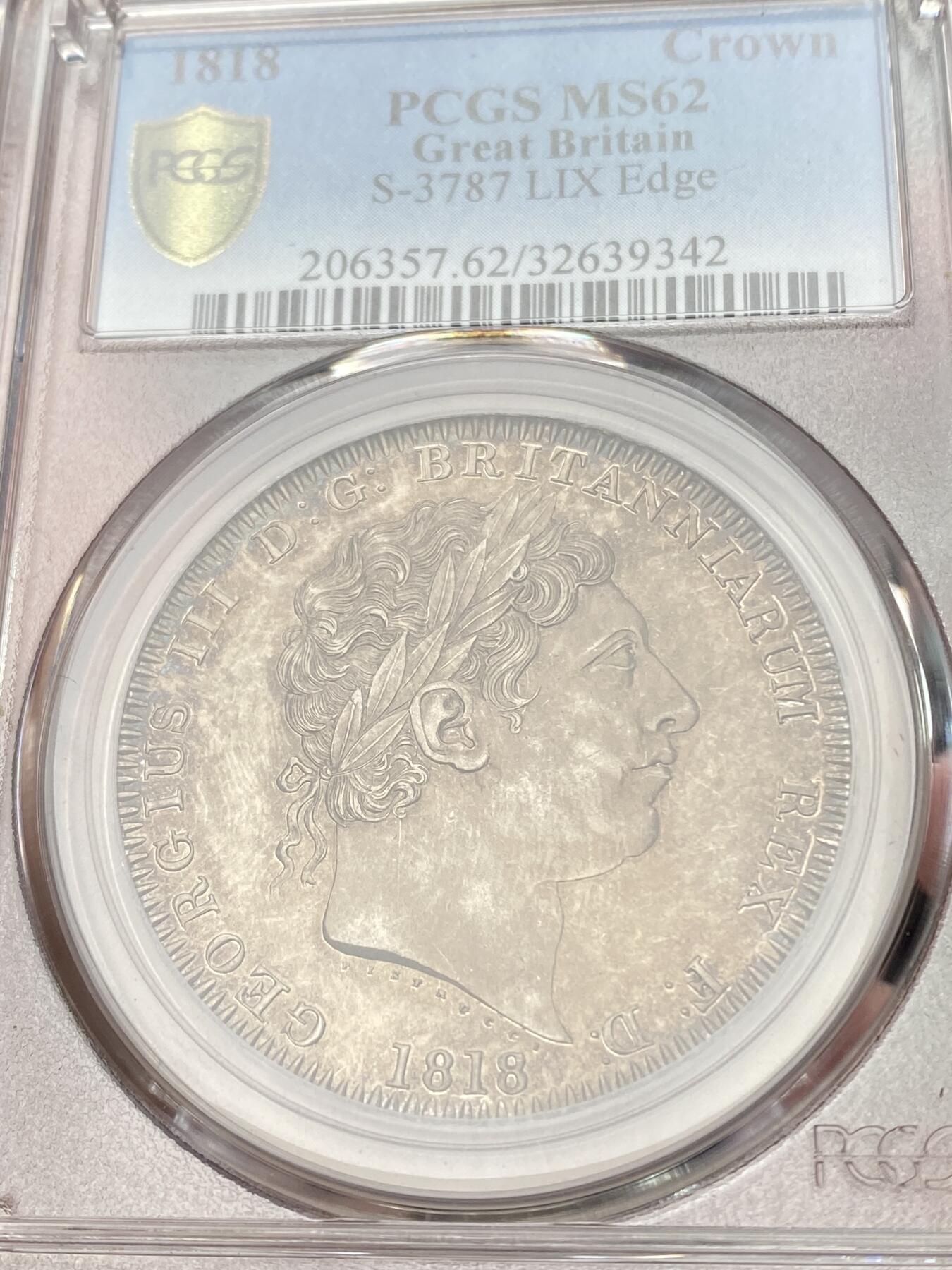 万国钱币拍卖第059期 PCGS MS62 1818年英国乔治三世马剑克朗大银 英国马剑系列首年开山之作 双面香槟色调环绕 细节锋利