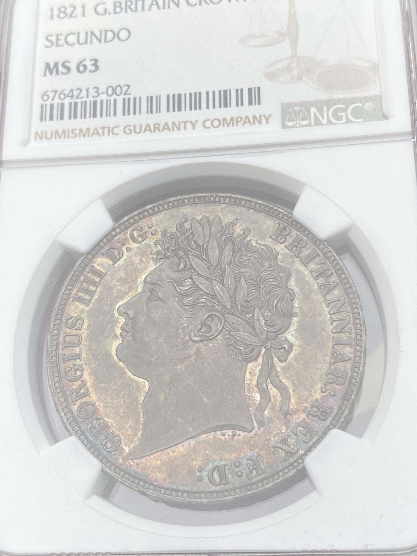 万国钱币拍卖第059期 NGC MS63 1821年SECUNDO英国乔治四世马剑克朗 英国马剑系列中的名誉品种 Pistrucci倾力之作 浓郁英伦五彩浮雕感极强 观感超越分数的状态 刚刚结束的SBP纽约拍卖62分成交价4320美金