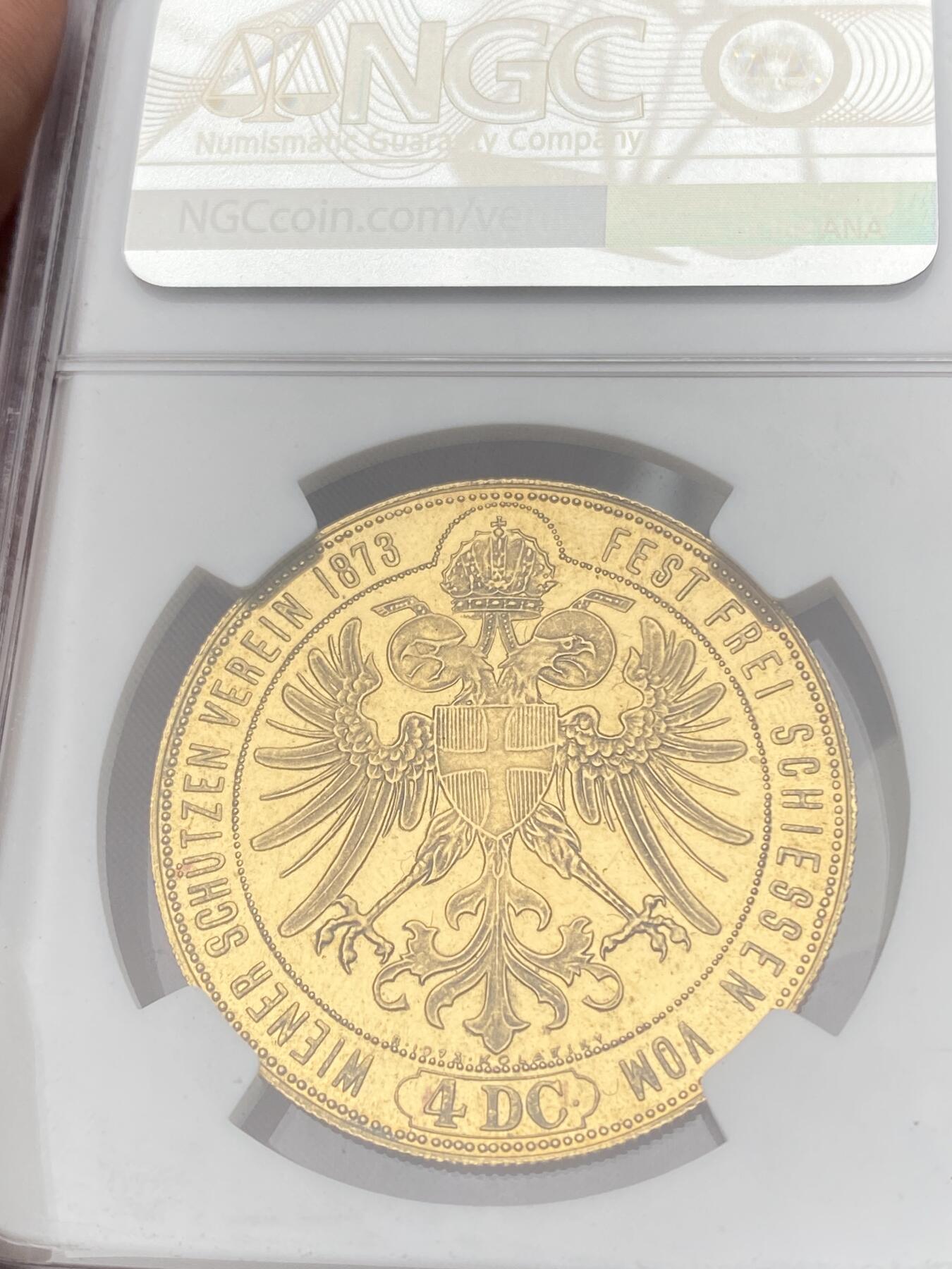 万国钱币拍卖第059期 NGC MS64PL 1873（1973年后铸）奥地利弗朗茨-约瑟夫一世维也纳射击节4杜卡特大金币 奥地利大名誉品种 其原铸价格已是高不可攀的存在 即便后铸也是难得一见 类镜面喷砂质感在黄金载体上更显华丽 22年VL Nummus拍卖原物 当时的成交价格就已经约合人民币9万元 不容错过的顶级奥地利章牌藏品