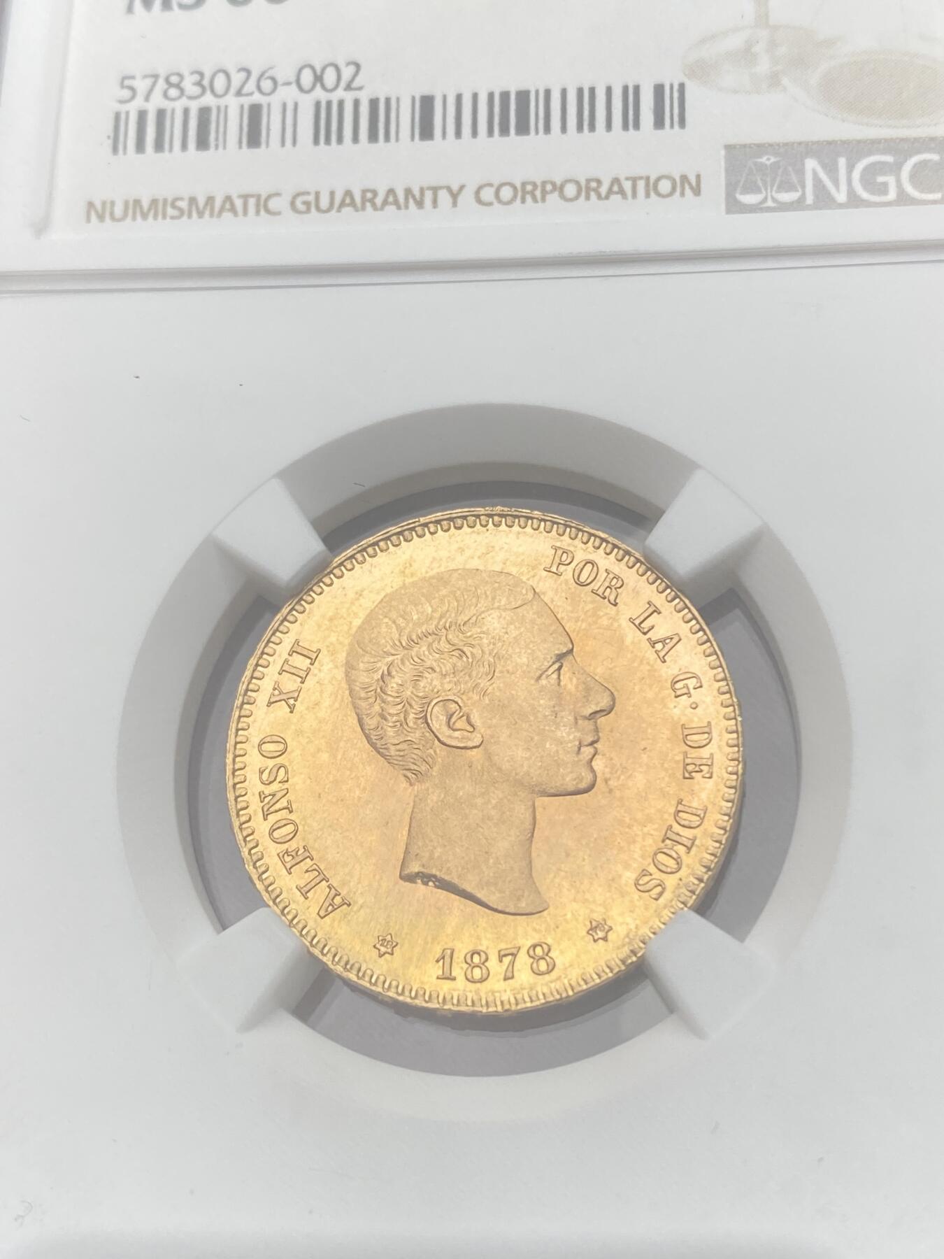 万国钱币拍卖第059期 NGC MS66 1878西班牙阿方索十二世25比塞塔金币 大量进入流通的西班牙金币品种 GEM级别可谓难得一见 丝绸金光类镜面质感 肉眼无暇状态 堪称完美的顶级典藏品质 8.06g 900金