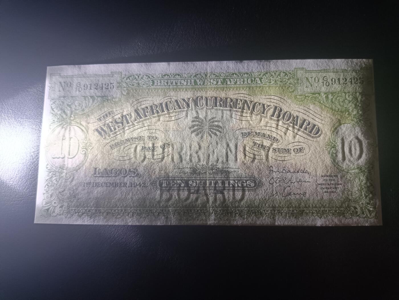 2026一月第四期，总214期 英属西非1942年10先令AUNC疑似裁切，稀有的英属西非时期中高面值，正面是椰树图案，背面是阿拉伯文的面值