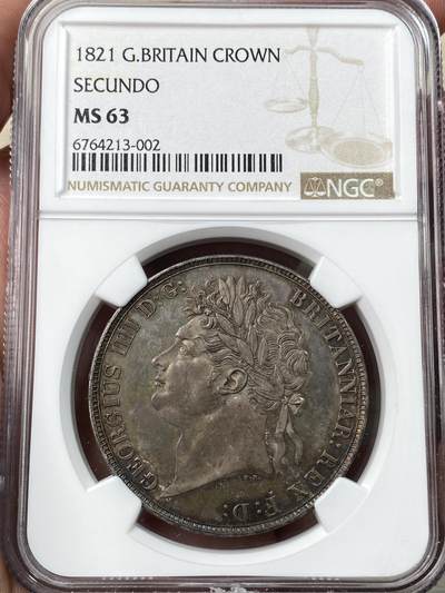 万国钱币拍卖第059期 - NGC MS63 1821年SECUNDO英国乔治四世马剑克朗 英国马剑系列中的名誉品种 Pistrucci倾力之作 浓郁英伦五彩浮雕感极强 观感超越分数的状态 刚刚结束的SBP纽约拍卖62分成交价4320美金