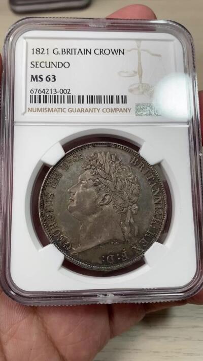 万国钱币拍卖第059期 NGC MS63 1821年SECUNDO英国乔治四世马剑克朗 英国马剑系列中的名誉品种 Pistrucci倾力之作 浓郁英伦五彩浮雕感极强 观感超越分数的状态 刚刚结束的SBP纽约拍卖62分成交价4320美金