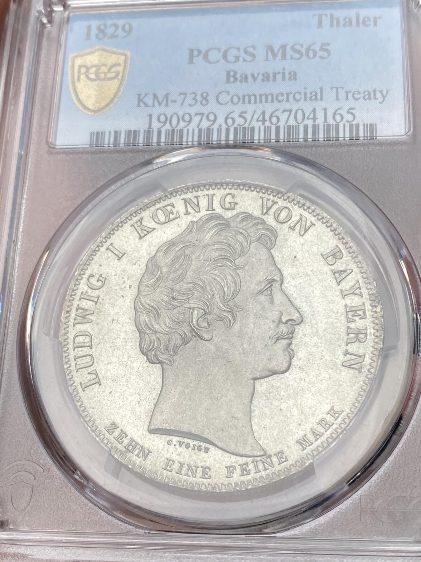 万国钱币拍卖第059期 PCGS MS65 1829年德国巴伐利亚路德维希一世贸易协定历史泰勒  纪念巴伐利亚、普鲁士、符腾堡和黑森之间的贸易协定泰勒 极其难得的BU级别历史大泰勒 银光在币面如流水般泻出  喷砂质感的四邦纹章紧密围绕在象征繁荣富裕的丰饶角周围 实物上手惊艳