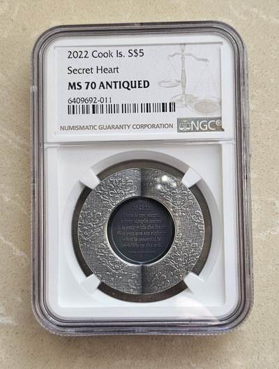 【币将精彩】世界钱币拍卖（2026-3-11） - 库克2022年爱的秘密立体仿古银币NGC评级币带证书包装