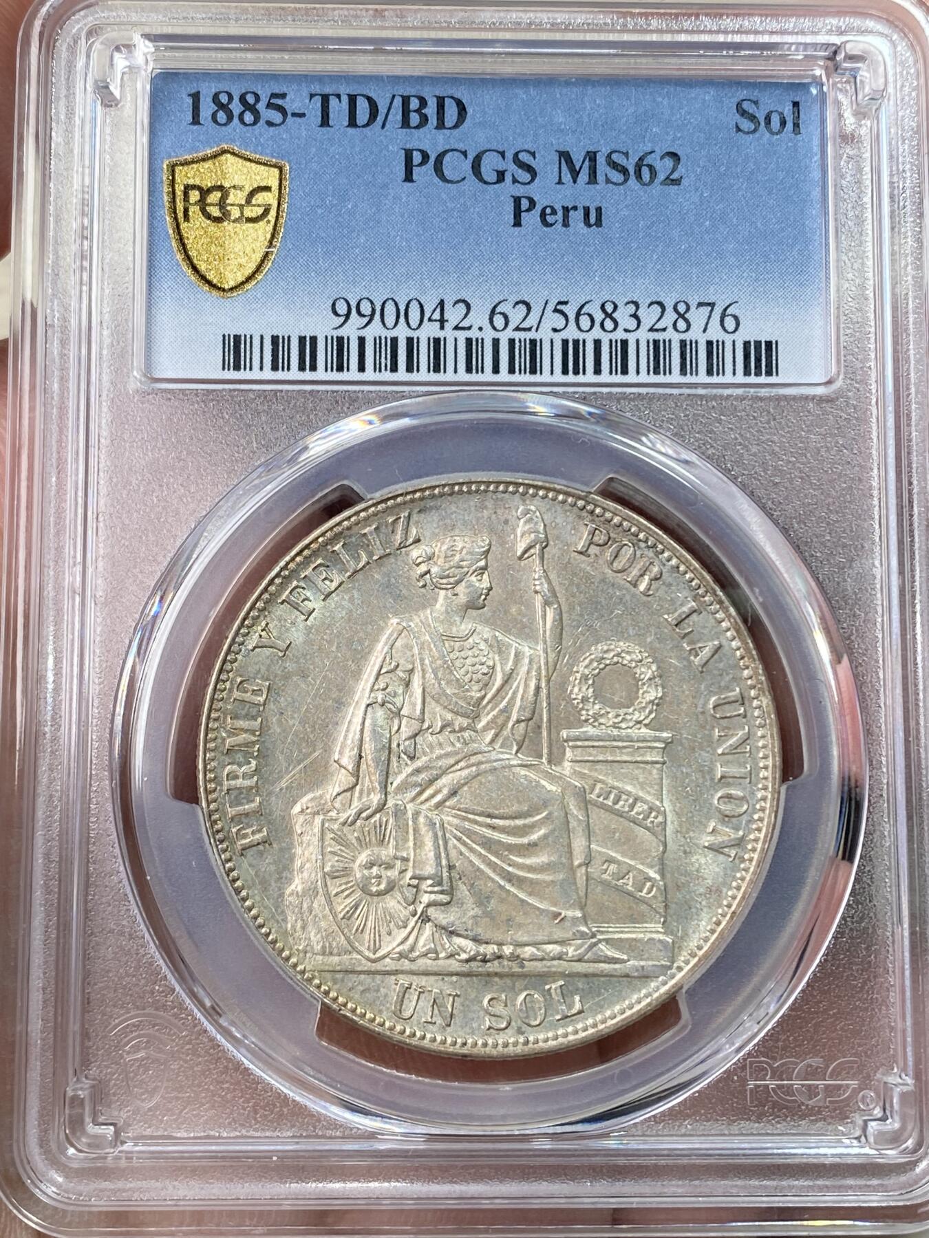 万国钱币拍卖第059期 PCGS MS62 1885年秘鲁坐人女神1索尔大银 深打转光收藏级品质