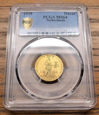 凡希社世界钱币微拍第三百十九期 - 1928荷兰贸易杜卡特金币PCGS-MS64，3.5g，983金，荷兰杜卡特金币是欧洲历史最悠久的贸易金币之一，从17世纪一直流通到20世纪，因其纯度稳定、重量标准，曾是全球贸易中的硬通货。