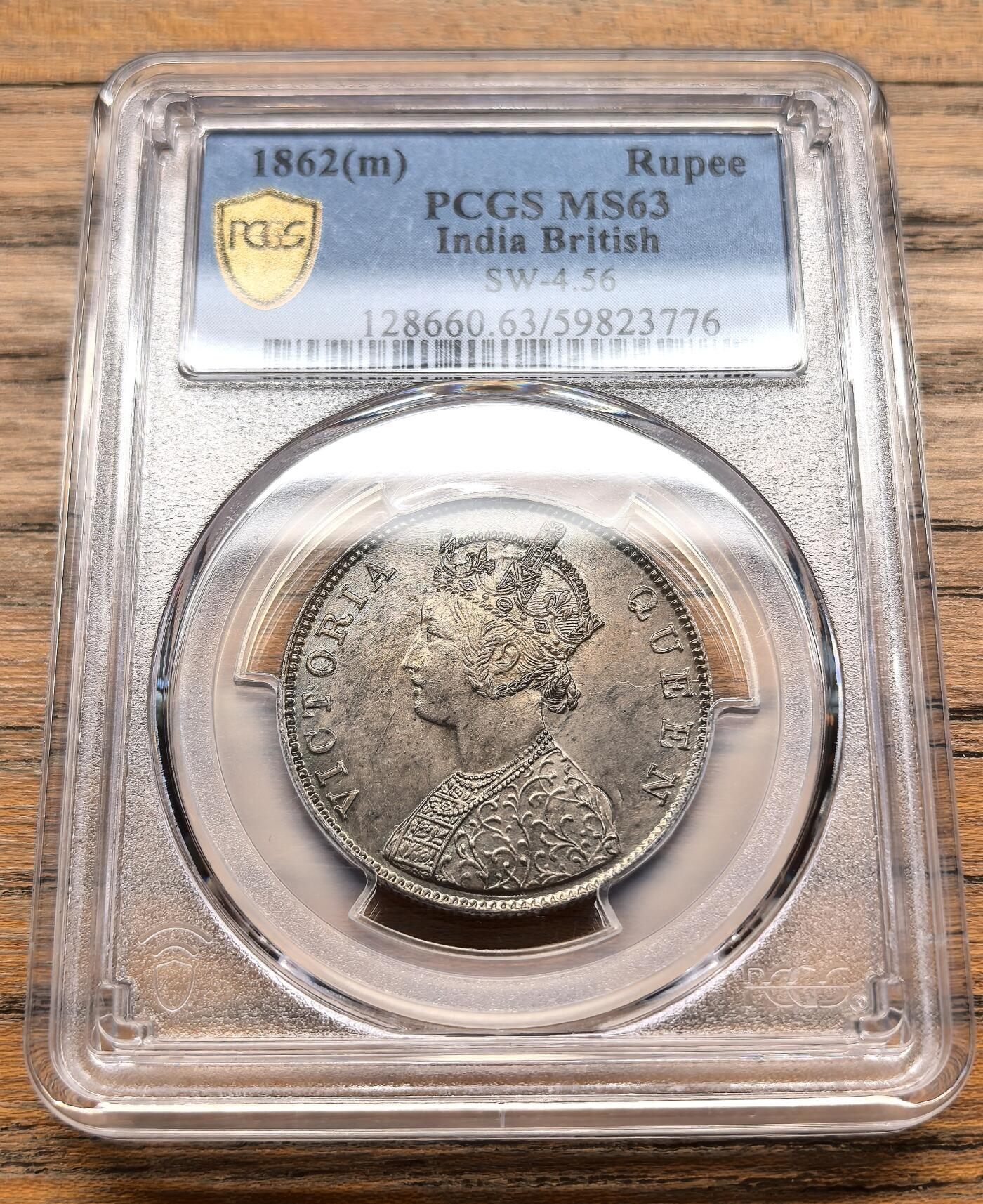 凡希社世界钱币微拍第三百十九期 1862英属印度小维像卢比银币PCGS-MS63，淡彩香槟金包浆，马德拉斯厂出品，较稀有的厂版。