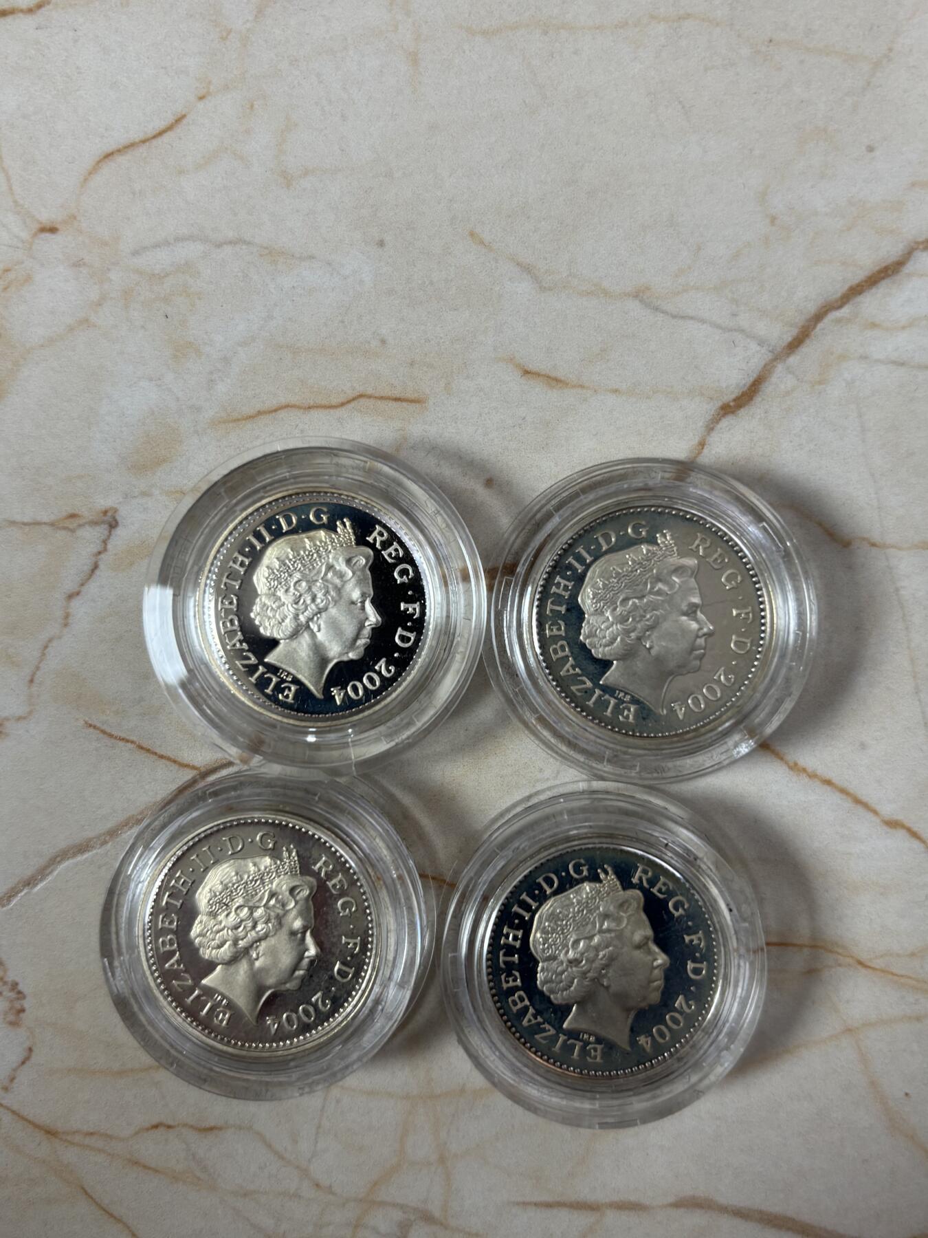 第189期拍卖 英国2004年皇室神兽1英镑精制纪念银币4枚全套，9.5克*4，发行5000套，有氧化