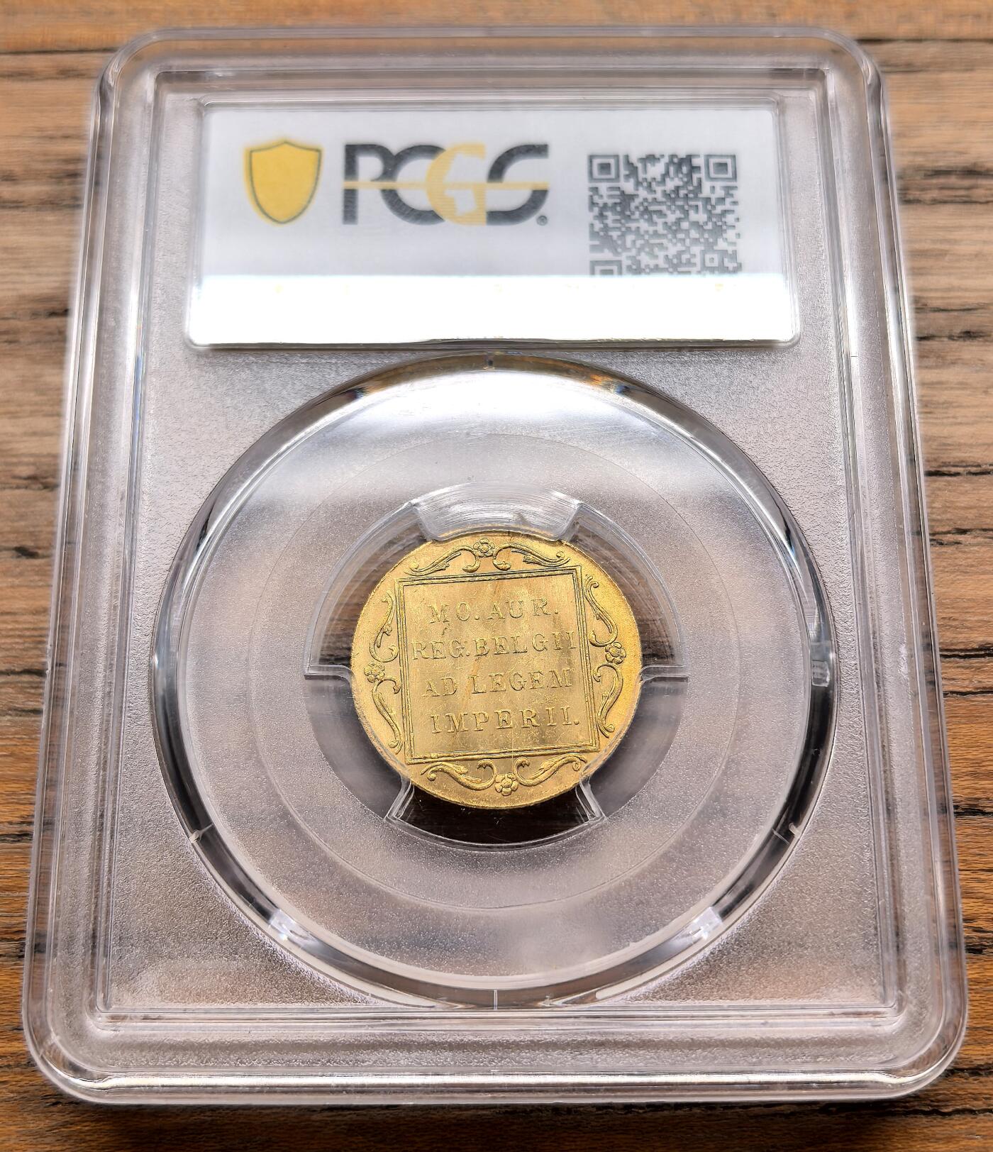 凡希社世界钱币微拍第三百十九期 1928荷兰贸易杜卡特金币PCGS-MS64，3.5g，983金，荷兰杜卡特金币是欧洲历史最悠久的贸易金币之一，从17世纪一直流通到20世纪，因其纯度稳定、重量标准，曾是全球贸易中的硬通货。