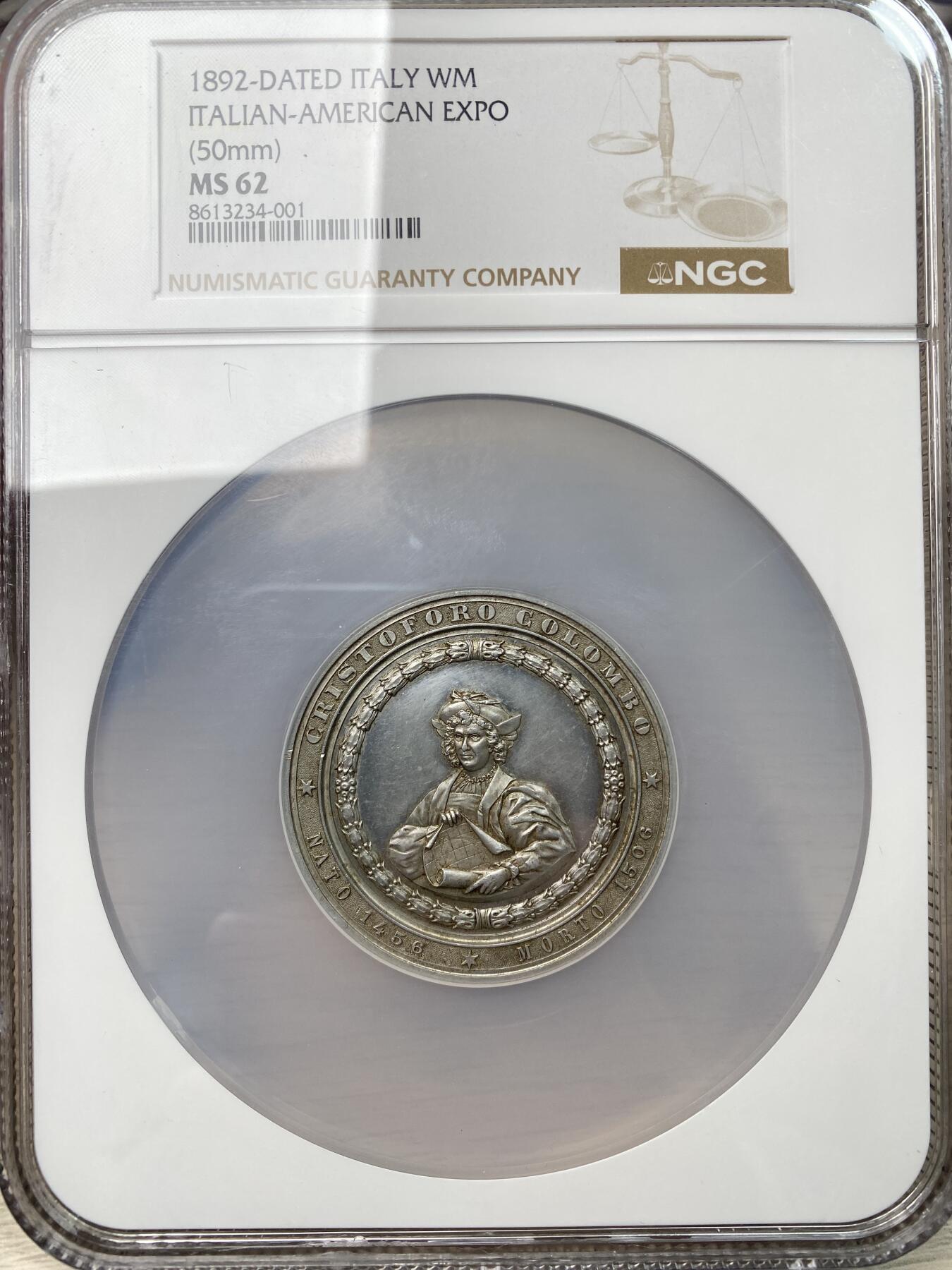 万国钱币拍卖第059期 NGC MS62 1892年意大利世界博览会哥伦布纪念大合金章 正面哥伦布手持航海地图 精制镜面高浮雕 50MM大规格