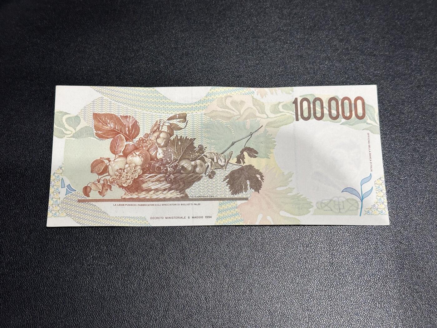 《外钞收藏家》第六百零四期（精品场）（本平台长期征集拍品、欢迎藏友们联系合作） 1994年意大利10万里拉 卡拉瓦乔 AU品相