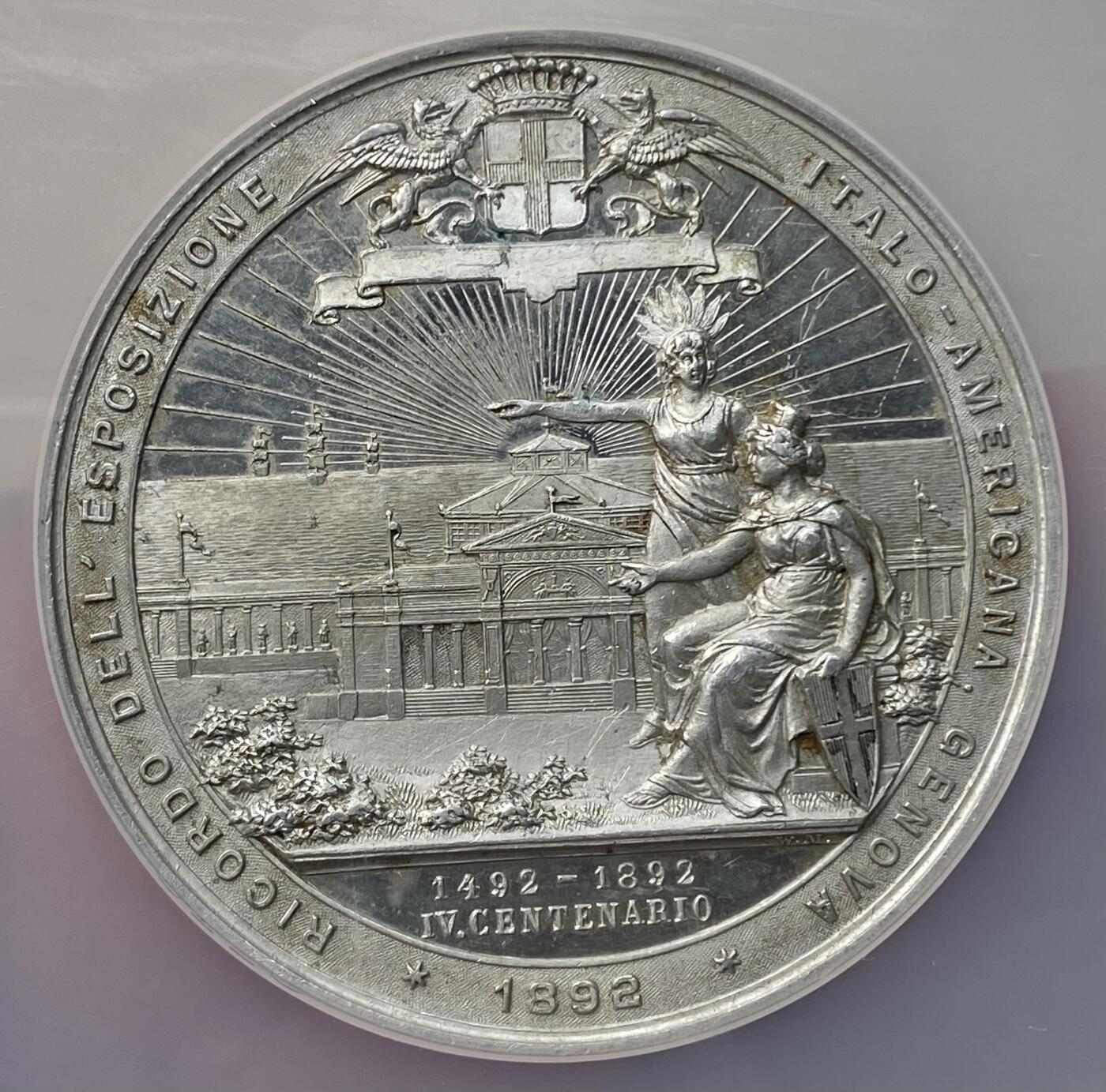 万国钱币拍卖第059期 NGC MS62 1892年意大利世界博览会哥伦布纪念大合金章 正面哥伦布手持航海地图 精制镜面高浮雕 50MM大规格