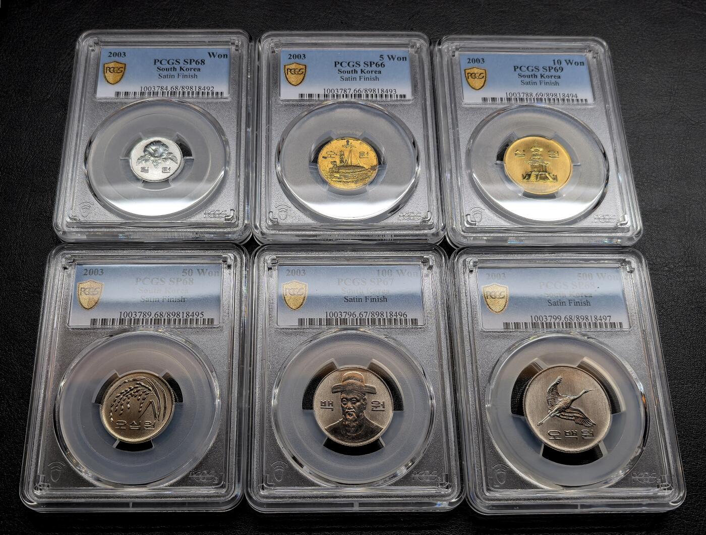 凡希社世界钱币微拍第三百十九期 荐！2003韩国“反向精制”流通样币六枚套PCGS-SP67/68/69，币面的喷砂面和高光镜面与普通精制正好相反，珍稀，P唯一一套评级记录。