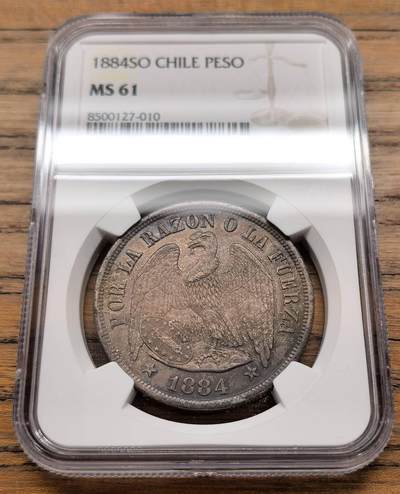 凡希社世界钱币微拍第三百十九期 - 1884SO智利老鹰比索大银NGC-MS61，美包浆。