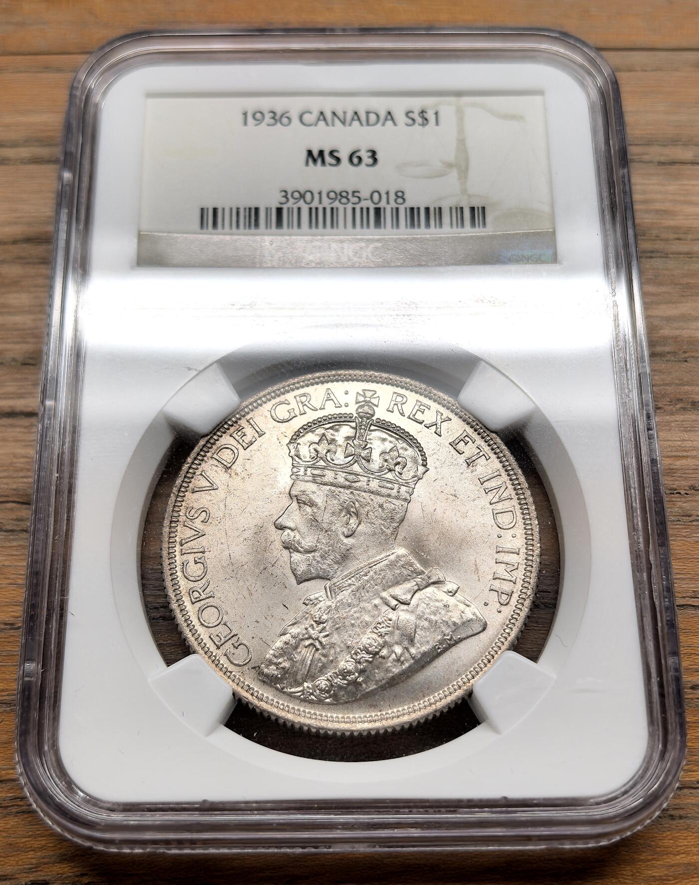 凡希社世界钱币微拍第三百十九期 1936加拿大乔五dollar大银NGC-MS63，淡彩紫金包浆，光泽极养眼的一枚！