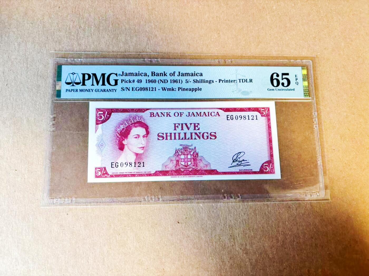 【Blue Auction】世界纸币精拍第779期——18级TOP拍卖/信誉/品质/专业/高效💫 【P-49拉丁铭文初版 央行首张纸币 无47】牙买加1960年5先令 邓斯河瀑布 纹章铭刻“Indus Uterque Serviet Uni/印第安人应侍奉主” 因殖民色彩浓厚仅在1962年独立前短暂发行 很快改版为“Out of Many One People” PMG65EPQ 评级量仅为常见版本1/5