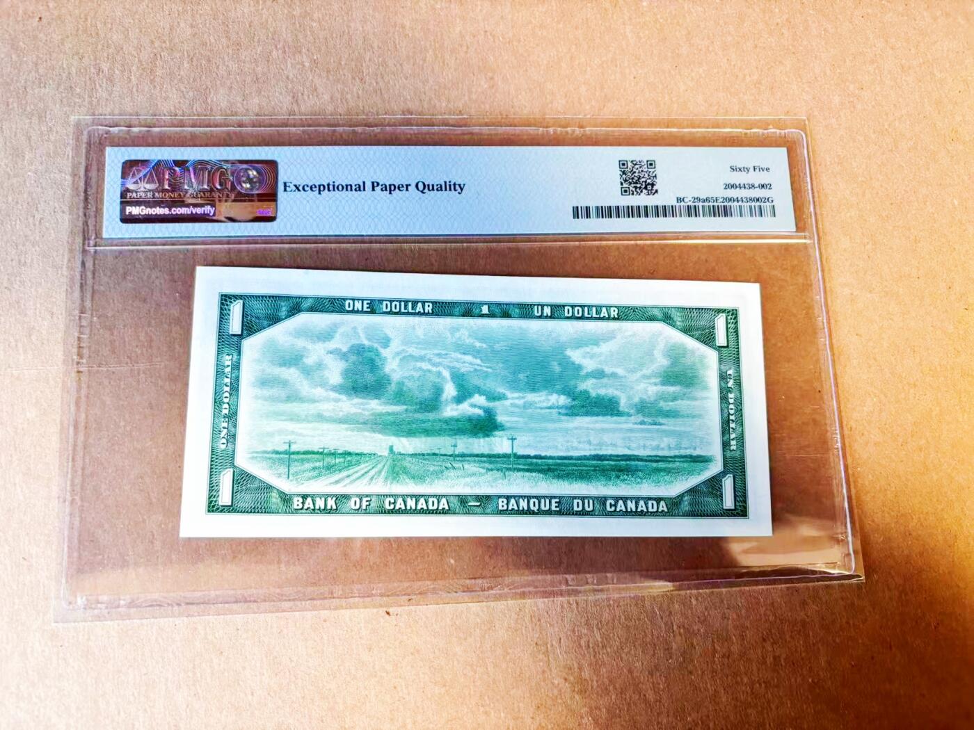 【Blue Auction】世界纸币精拍第779期——18级TOP拍卖/信誉/品质/专业/高效💫 【魔鬼脸 A/A首发冠 百位小号】加拿大1954年1元 PMG65EPQ