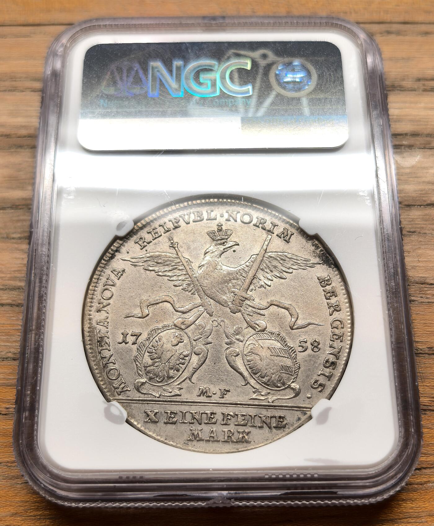 凡希社世界钱币微拍第三百十九期 1758神罗纽伦堡自由市佛朗茨一世泰勒大银NGC-AUD，纽伦堡是神圣罗马帝国时期最重要的商业与造币中心之一，这枚泰勒发行于弗朗茨一世皇帝统治时期，是当时中欧地区的核心流通货币，兼具贸易与储备功能。
