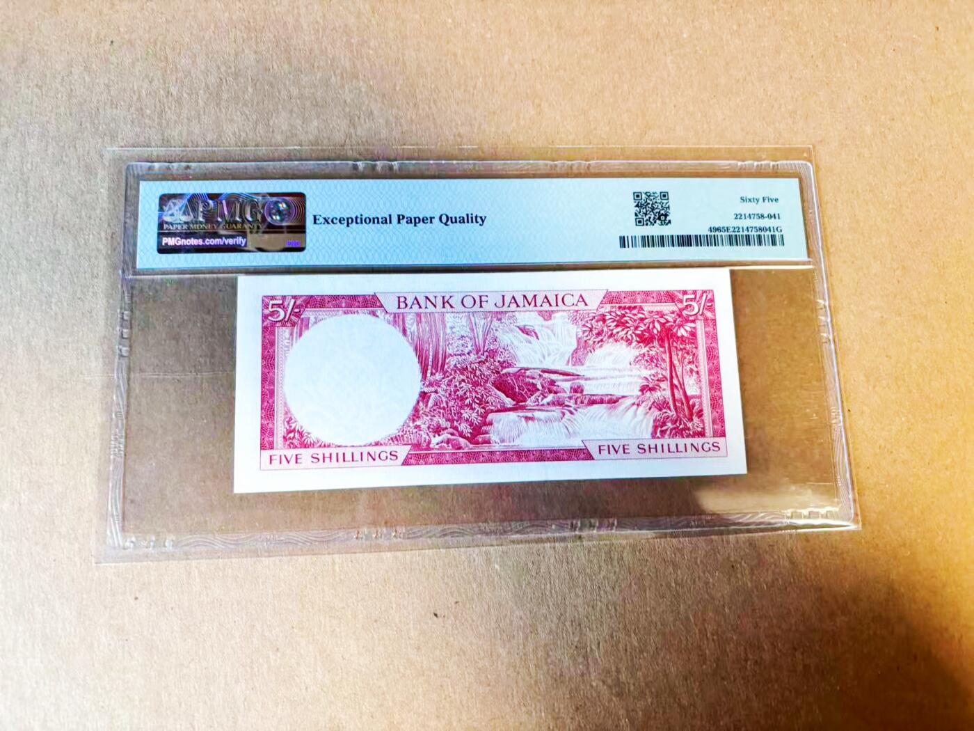 【Blue Auction】世界纸币精拍第779期——18级TOP拍卖/信誉/品质/专业/高效💫 【P-49拉丁铭文初版 央行首张纸币 无47】牙买加1960年5先令 邓斯河瀑布 纹章铭刻“Indus Uterque Serviet Uni/印第安人应侍奉主” 因殖民色彩浓厚仅在1962年独立前短暂发行 很快改版为“Out of Many One People” PMG65EPQ 评级量仅为常见版本1/5