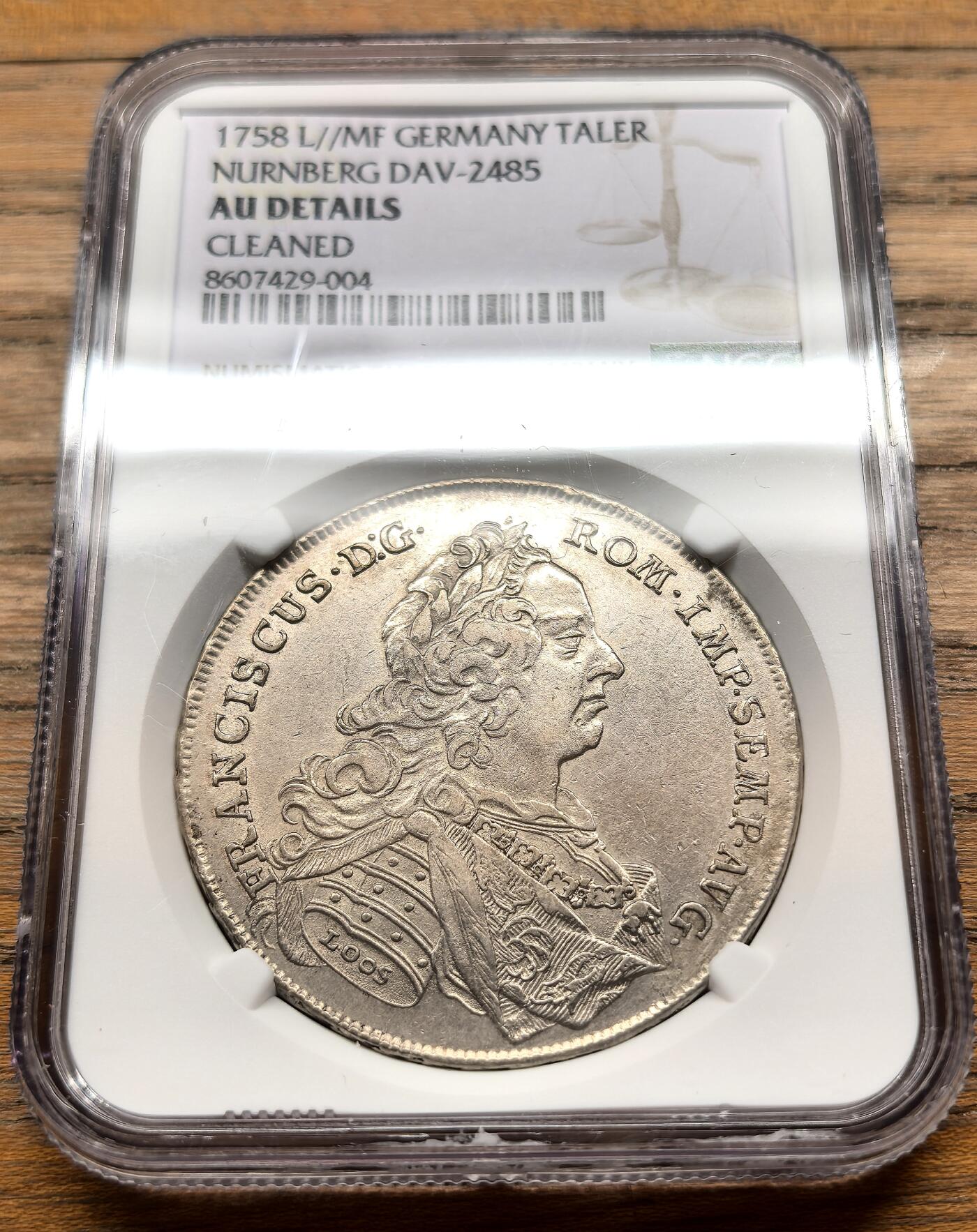 凡希社世界钱币微拍第三百十九期 1758神罗纽伦堡自由市佛朗茨一世泰勒大银NGC-AUD，纽伦堡是神圣罗马帝国时期最重要的商业与造币中心之一，这枚泰勒发行于弗朗茨一世皇帝统治时期，是当时中欧地区的核心流通货币，兼具贸易与储备功能。