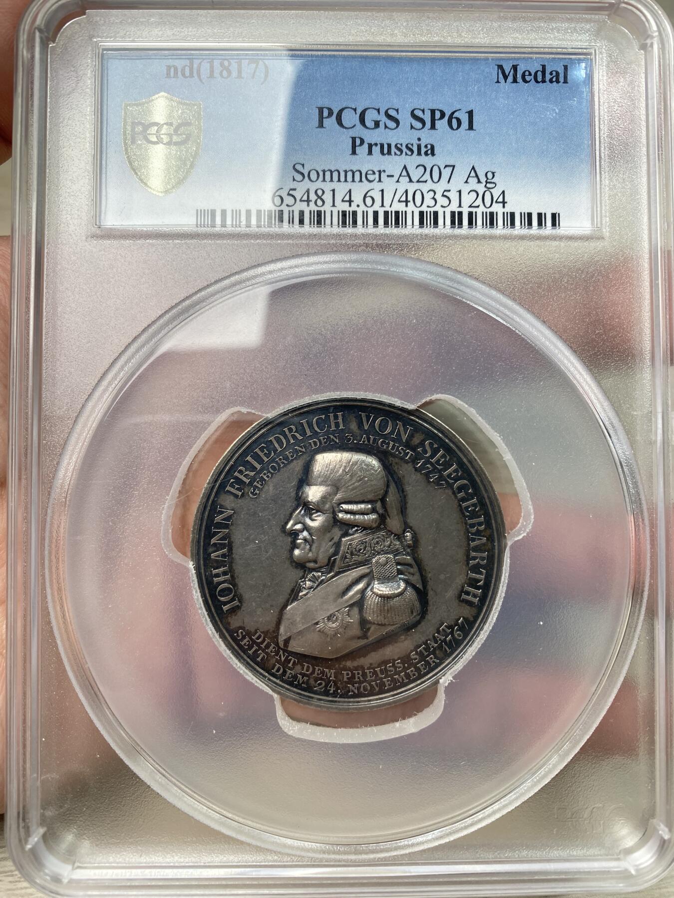 万国钱币拍卖第059期 PCGS SP61 1817年德国普鲁士威廉三世时期约翰·弗里德里希·冯·西格巴特邮政局长忠诚服务50周年纪念大银章 老容克戎装侧向 背面文字意为：献给总邮政局长以庆祝五十年服务庆典，由总邮政厅及宫廷邮政局全体员工敬献 47mm大规格 少见品种收藏品质
