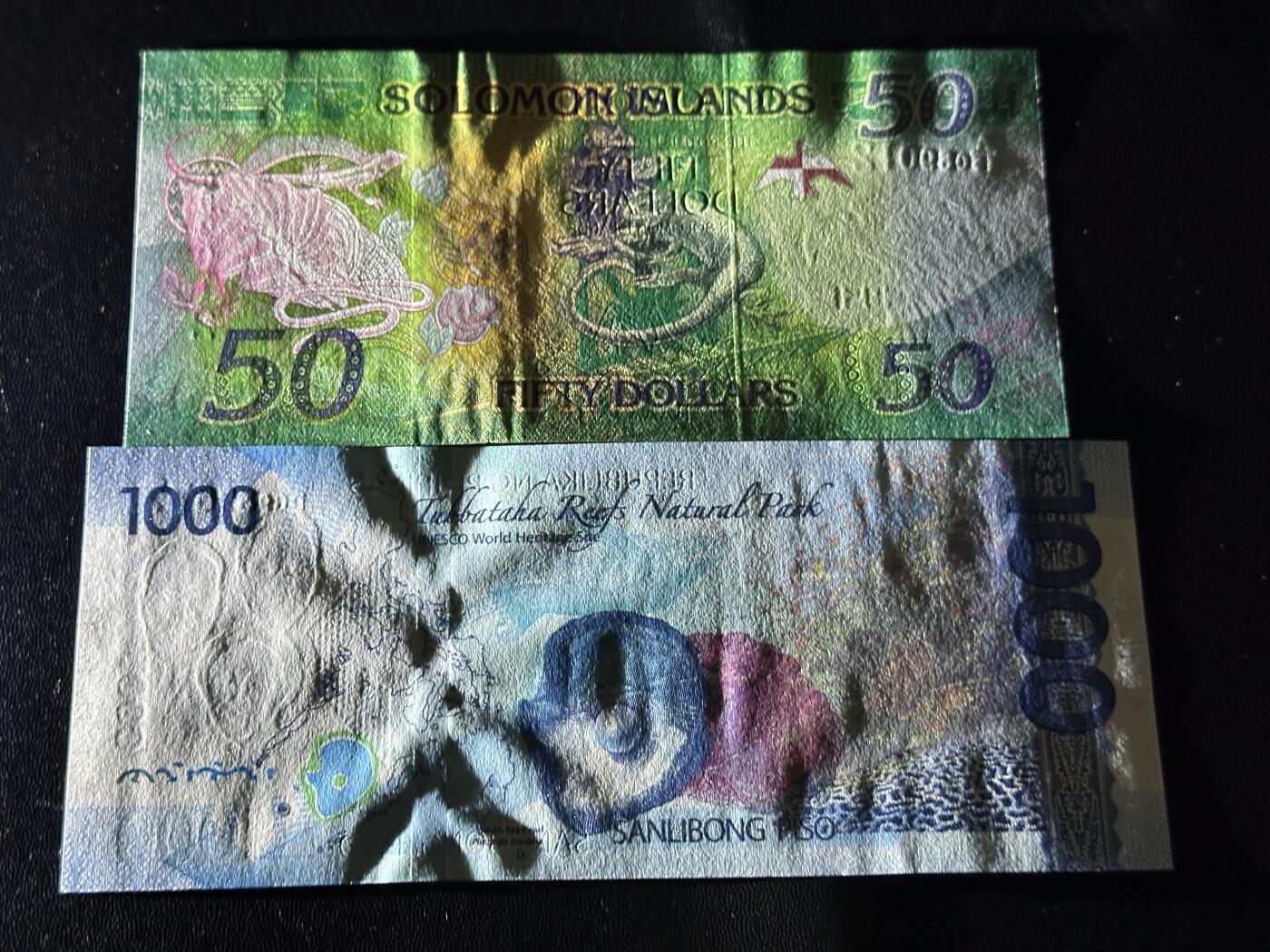 《外钞收藏家》第六百零五期（精选场）（本平台长期征集拍品、欢迎藏友们联系合作） 所罗门群岛50 无47靓号+菲律宾1000比索 2张一起 全新UNC