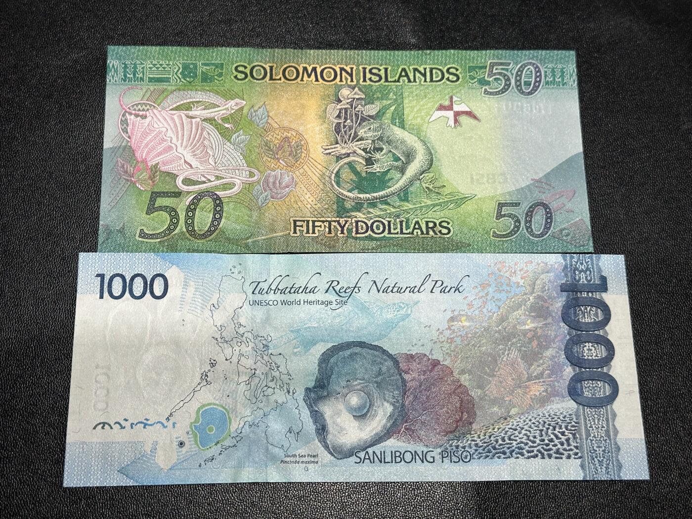 《外钞收藏家》第六百零五期（精选场）（本平台长期征集拍品、欢迎藏友们联系合作） 所罗门群岛50 无47靓号+菲律宾1000比索 2张一起 全新UNC