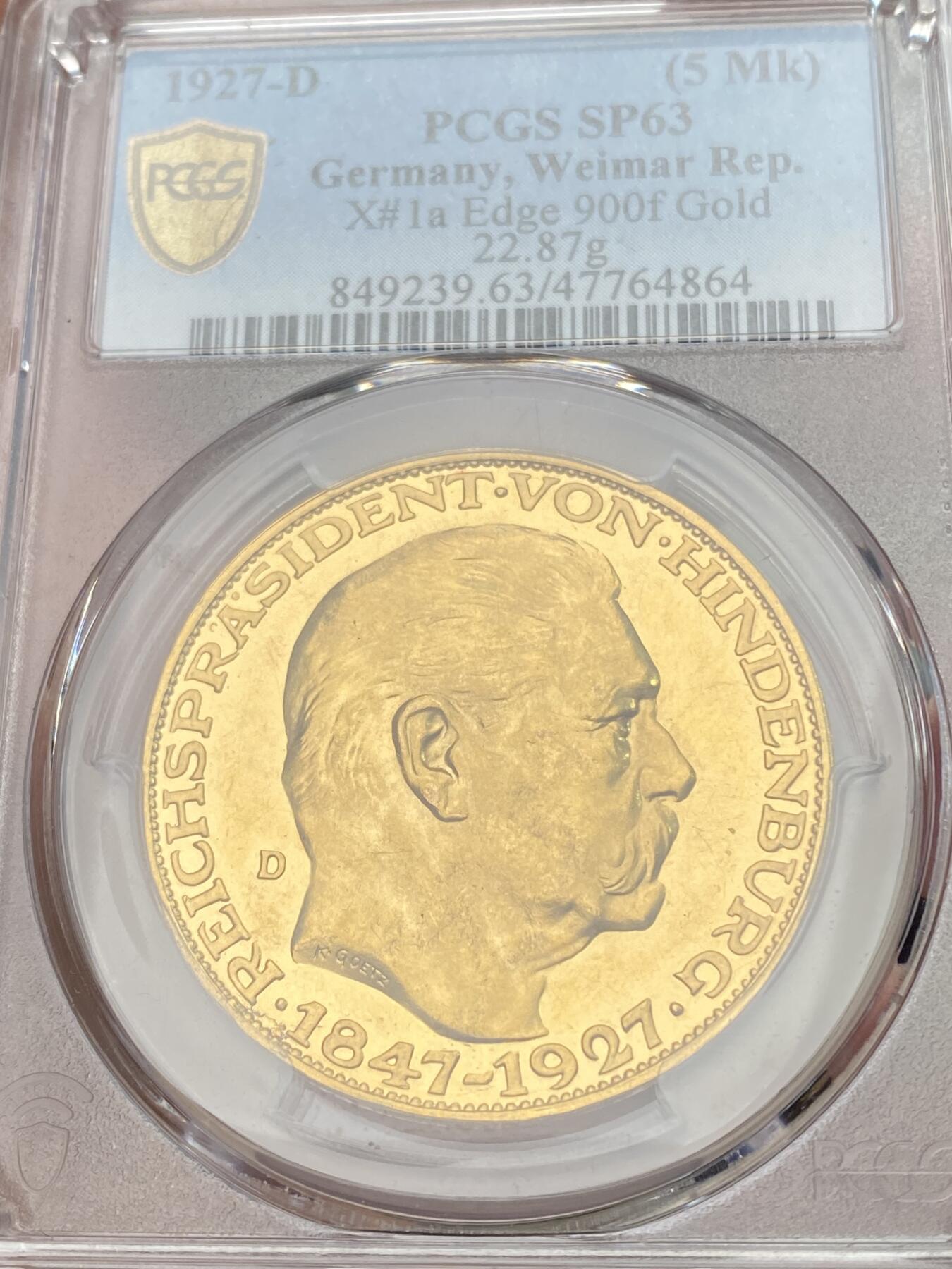 万国钱币拍卖第059期 PCGS SP63 1927年德国魏玛共和国兴登堡总统80大寿5马克金质币章 卡尔哥茨经典设计黄金化后异常诱人 其镜子般的深度镜面令人着迷 大尺寸金章无论何时均是人见人爱的品种 入手黄金的绝佳机会 22.87g 900金