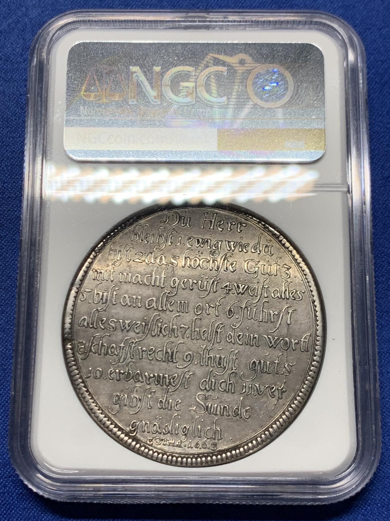 《竞宝斋》第461场 周日，周一，2场连拍 （全场包邮）欢迎送拍 NGC AU 德国 1668年  萨克森-哥达-阿尔滕堡公国 教理问答泰勒 非常稀有的品种  最近VF-XF的裸币成交价 1.6-2W  三线之内象征三位一体，光芒四射，象征上帝的各种特质；下方为天意之眼