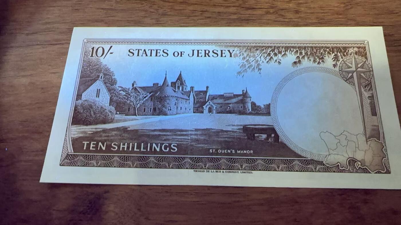 徐霞客拍卖首拍 泽西岛	P-7 1963年10先令	UNC- B256340			发行于20世纪中后期，是泽西岛当时流通的法定货币。它融合了英联邦货币风格与本土标识的设计，以君主肖像为核心元素，兼具流通功能与身份象征意义，见证了泽西岛货币体系的独立发展与英联邦金融关联，是研究该地区金融史与殖民文化传承的实物佐证。其收藏价值源于存世量稀少，在小众地域货币收藏中独具辨识度。	