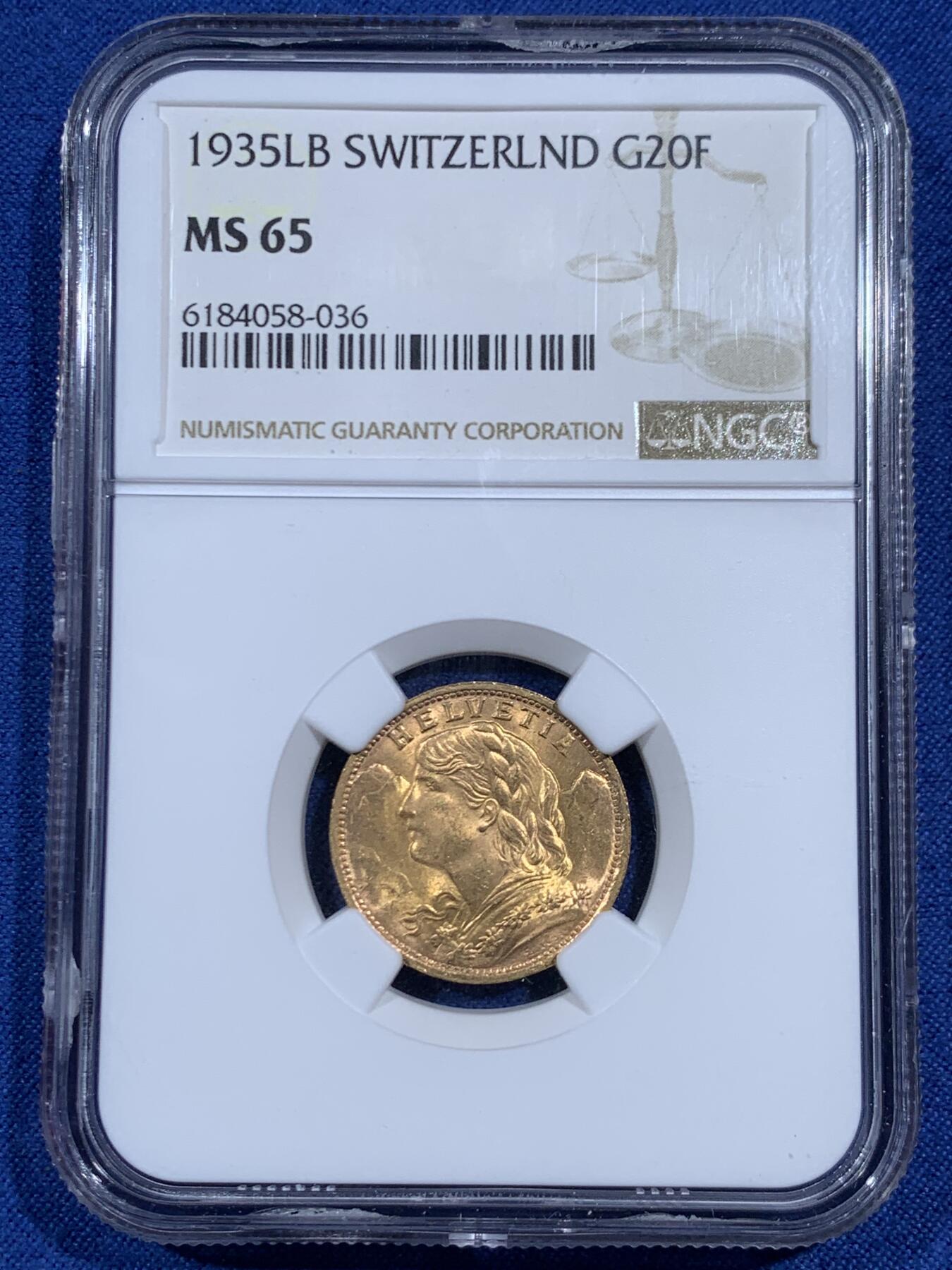 《竞宝斋》第461场 周日，周一，2场连拍 （全场包邮）欢迎送拍 NGC MS65 瑞士1935年雪山女神20法郎金币 超越分数的状态 底板细腻无扰动 整体转光丝滑 金色通透均匀 人像高点完整 细节锐利 属于MS65中明显上段水准的精品状态 900金 6.45克