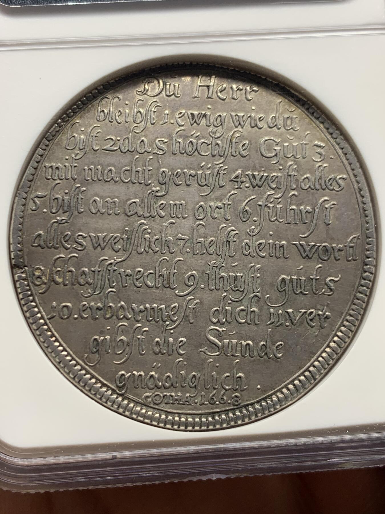 《竞宝斋》第461场 周日，周一，2场连拍 （全场包邮）欢迎送拍 NGC AU 德国 1668年  萨克森-哥达-阿尔滕堡公国 教理问答泰勒 非常稀有的品种  最近VF-XF的裸币成交价 1.6-2W  三线之内象征三位一体，光芒四射，象征上帝的各种特质；下方为天意之眼