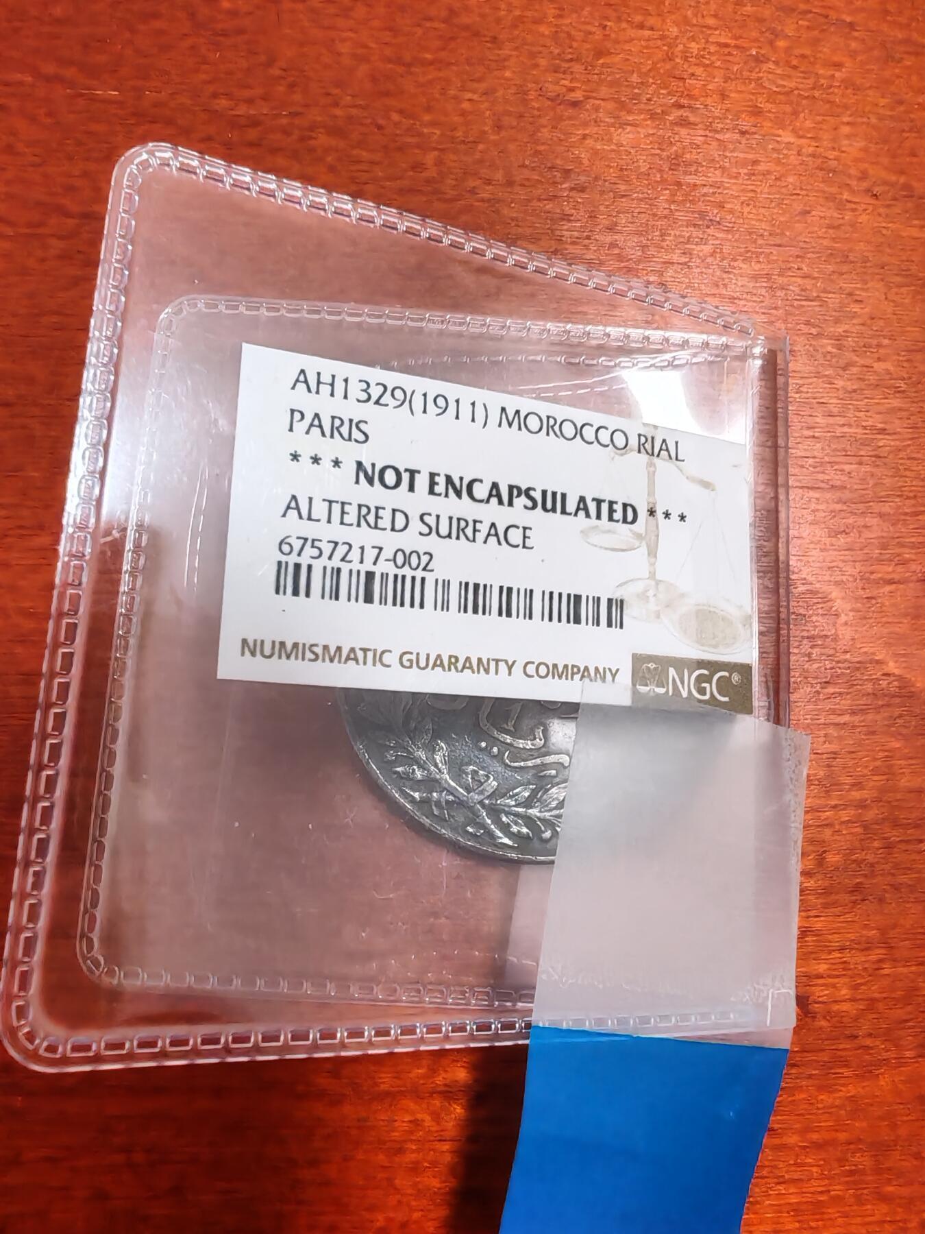 长老汇蛇年精选第九十六场拍卖 1911摩洛哥1里亚尔银币，25克900银，NGC判币面修改没入盒