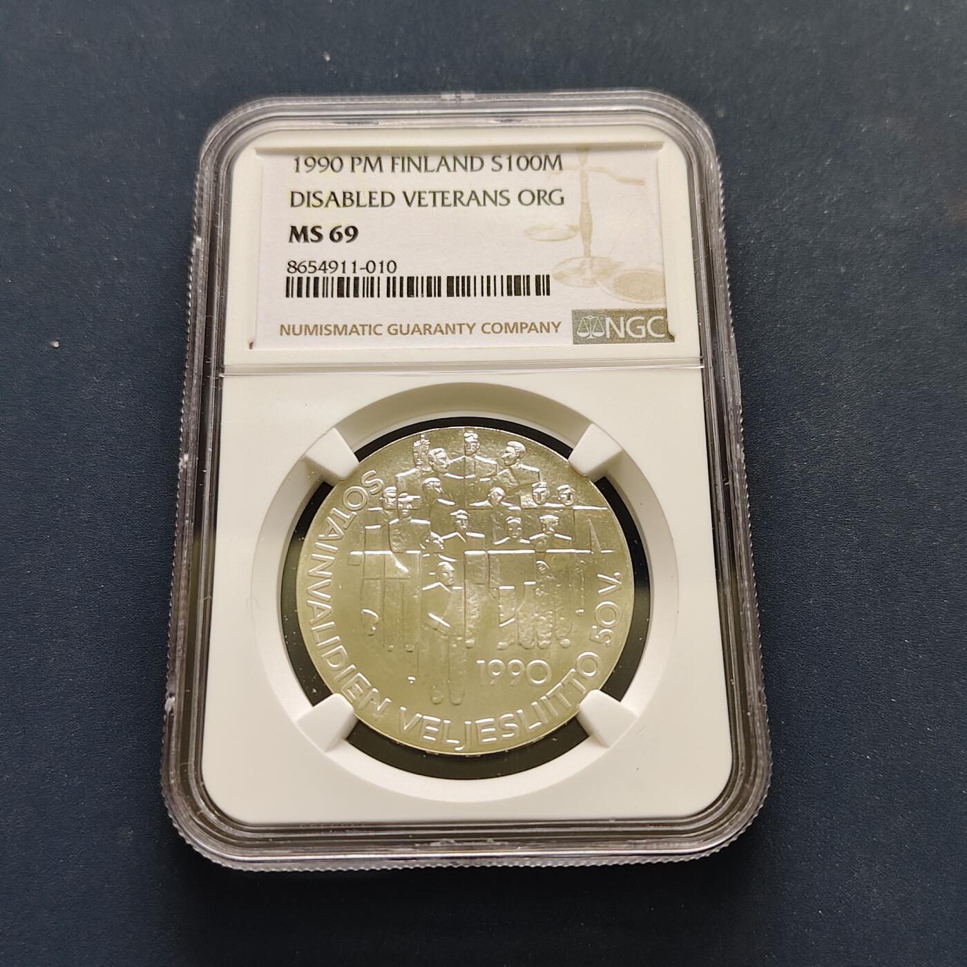 【全场包邮】纯粹捡漏拍499场-持续更新中 【收藏级·亚军分】芬兰1990年100马克伤残退伍军人50周年纪念银币【35毫米24克83%，纯银价约558元（按28元银价估算）】-NGC MS69（更高分仅2枚）