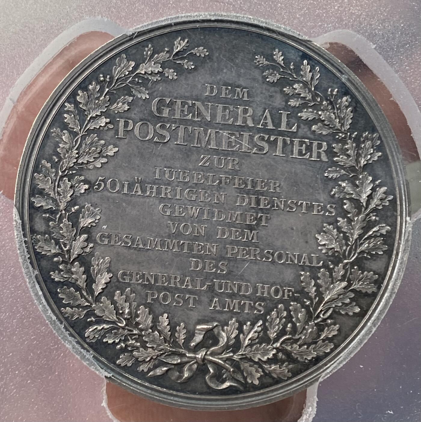 万国钱币拍卖第059期 PCGS SP61 1817年德国普鲁士威廉三世时期约翰·弗里德里希·冯·西格巴特邮政局长忠诚服务50周年纪念大银章 老容克戎装侧向 背面文字意为：献给总邮政局长以庆祝五十年服务庆典，由总邮政厅及宫廷邮政局全体员工敬献 47mm大规格 少见品种收藏品质