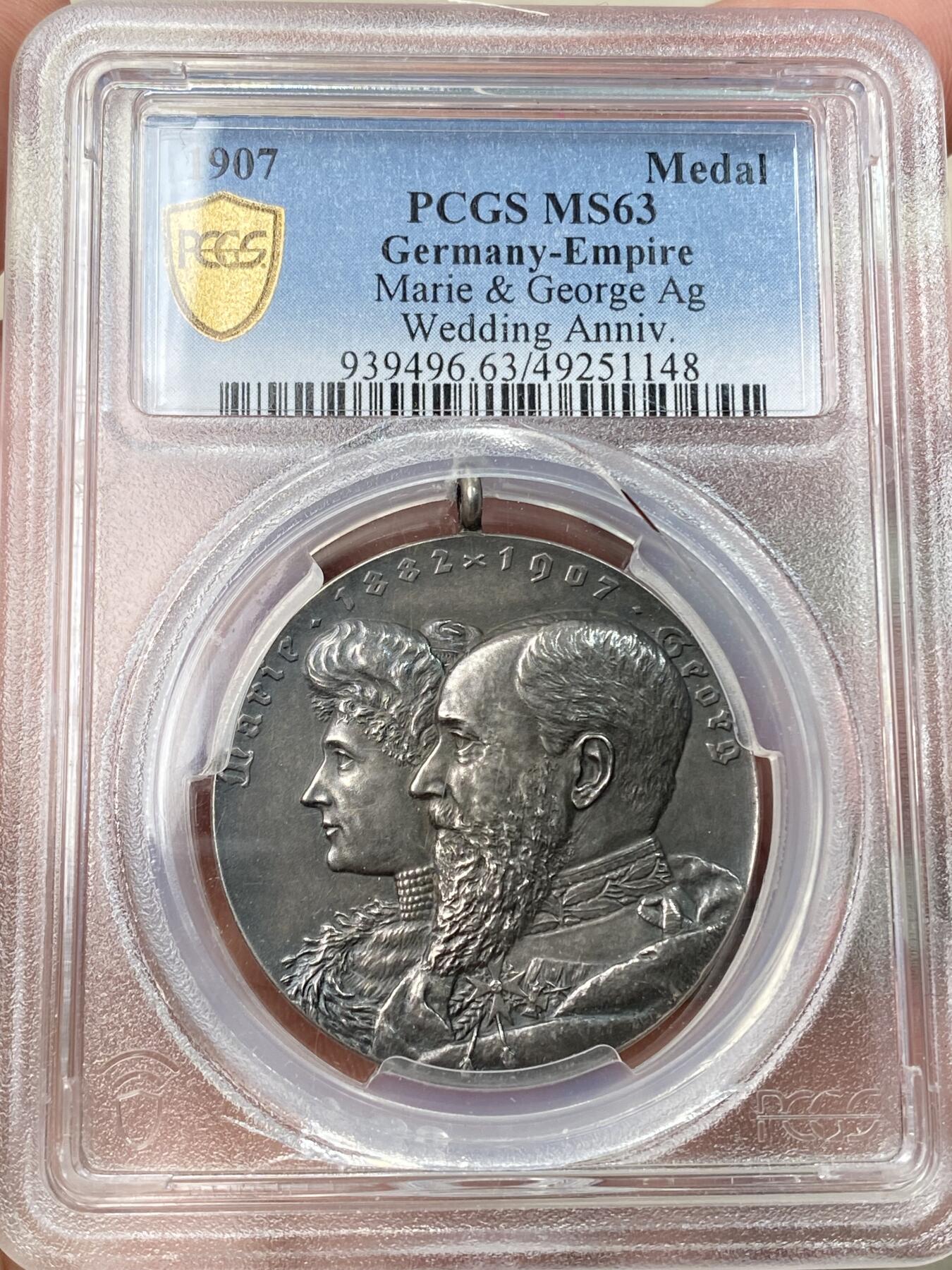 万国钱币拍卖第059期 PCGS MS63 1907年德国绍姆堡-利珀王室婚礼银婚纪念大银章 PC唯一记录 绍姆堡的乔治王子与安妮公主的银婚纪念 罕见品种反面双家族纹章