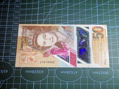 【炜奕收藏】，第五十八期，英属第三场 - 东加勒比地区50元，UNC品相，号码倒置号