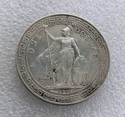 外国优质老铜币高银银币，周六九点倒数截拍，满百包邮，持续收拍 - 1911 年英国贸易银元（站洋）壹圆银币，正面为持三叉戟、盾的不列颠女神，下有帆船与年份；背面铸 “壹圆”、寿字纹及阿拉伯文，外圈回纹。为晚清至民国流通的国际银圆，见证中英贸易史，是经典外国银圆品种。表面有过处理，未入盒