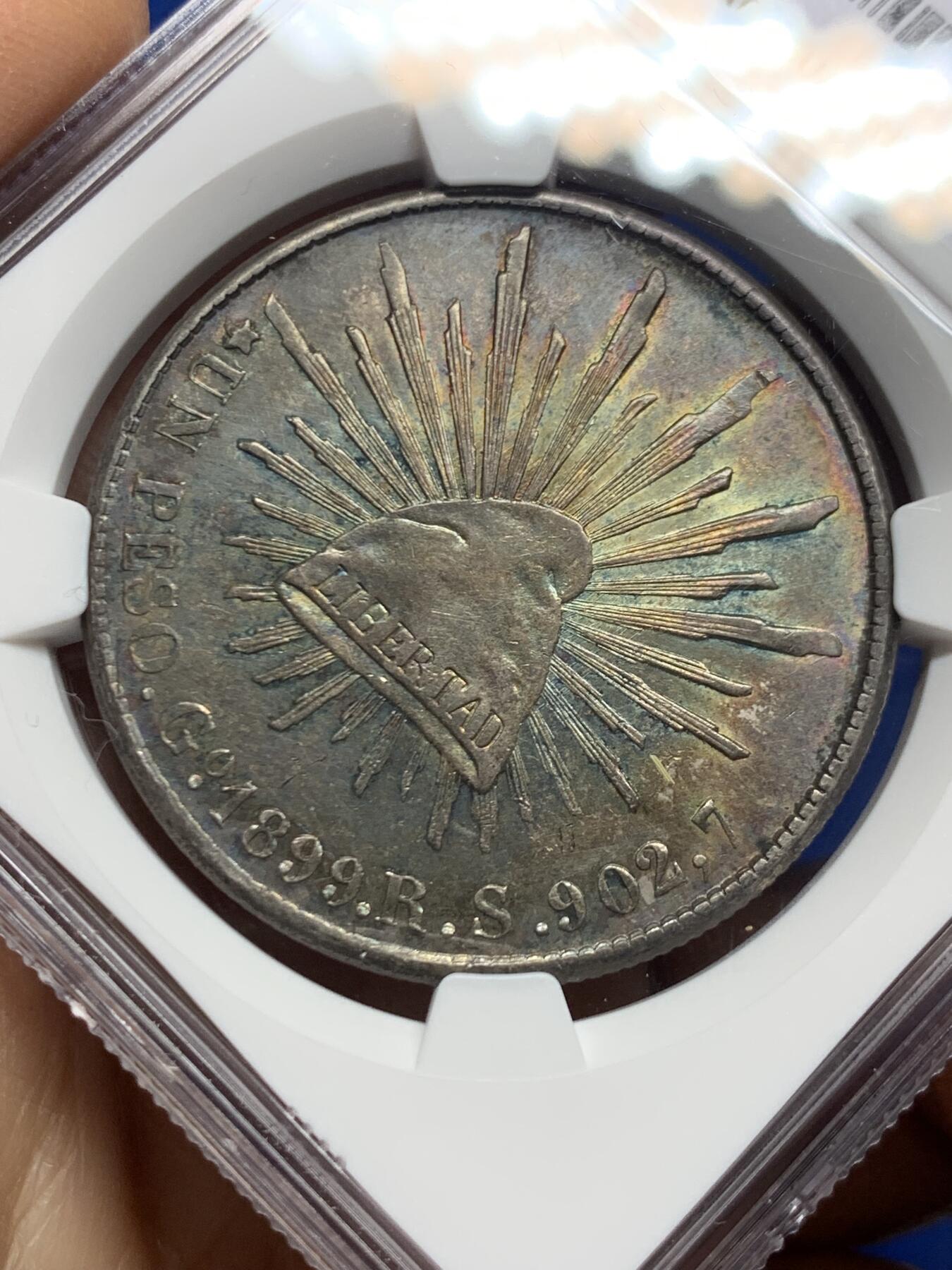 《竞宝斋》第462场 周日，周一，2场连拍 （全场包邮）欢迎送拍 NGC AUD 墨西哥1899年GORS版比索银币，五彩转光，非常漂亮的彩和状态，不理解为啥没分，可以尝试重评