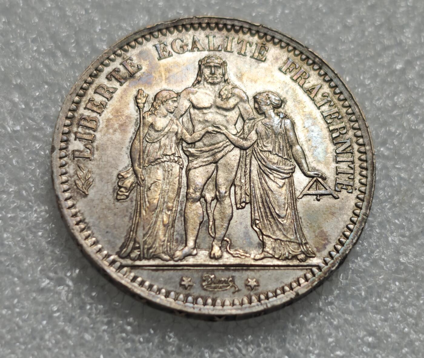 瓶子🏺第227期拍卖会  1873年法国大力神5法郎银币  好品带彩  25.12克  25×0.9×27=607.5