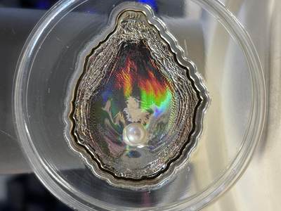 第189期拍卖 - 获奖帕劳2011年玉蚌含珠镶嵌珍珠异形纪念银币，25克，925银，发行2500枚