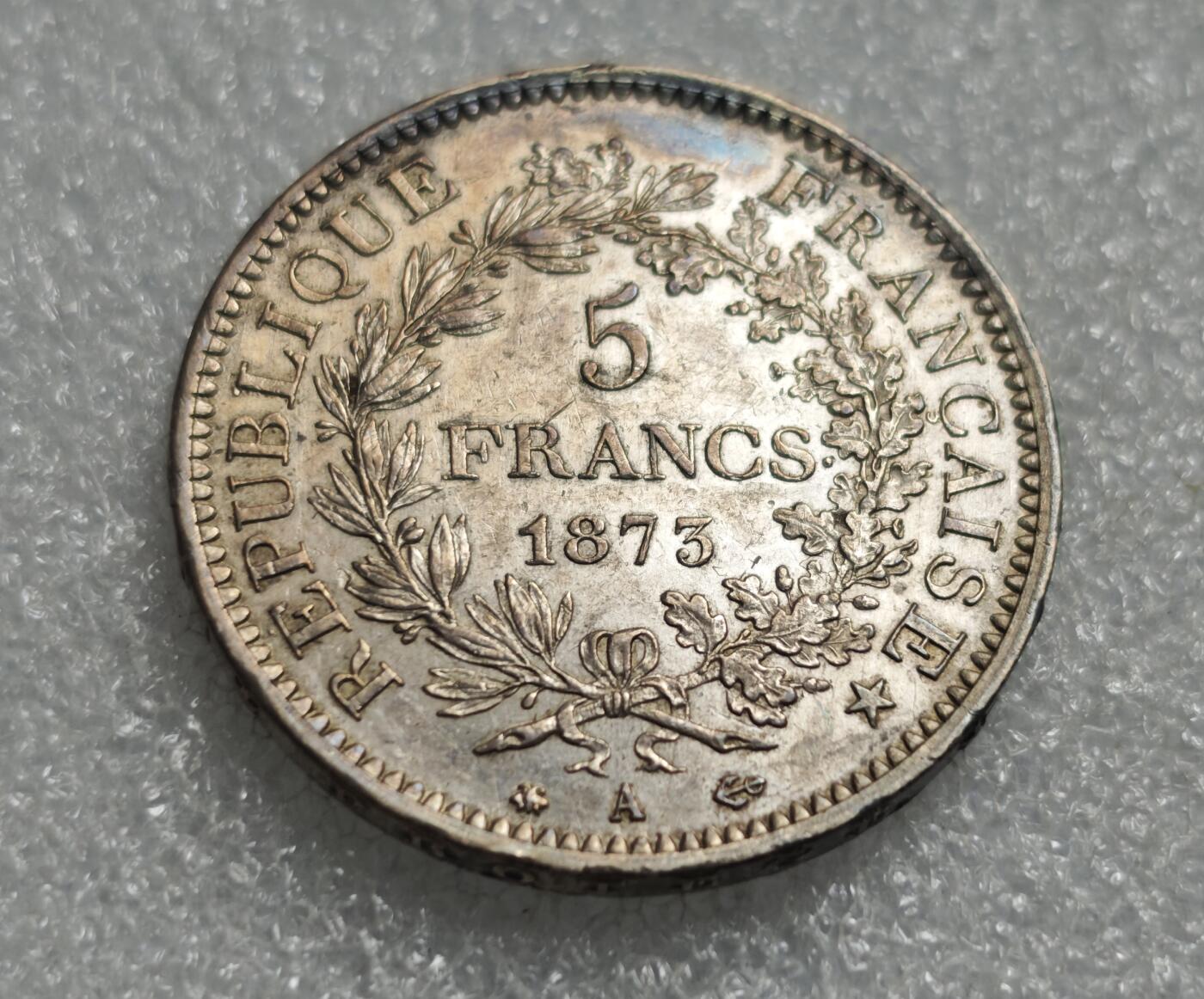 瓶子🏺第227期拍卖会  1873年法国大力神5法郎银币  好品带彩  25.12克  25×0.9×27=607.5