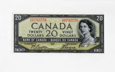 徐霞客拍卖首拍 - 加拿大	P-70b 1954年20法郎 魔鬼脸		E/E 0792776	加拿大银行1954年版20元纸币，因女王头发暗纹形似“魔鬼脸”成收藏热点。正面伊丽莎白二世像配英法双语面额，属“加拿大风景”系列，见证战后加国货币体系发展。采用雕刻凹印、双色套印及肖像水印防伪，背面景观尽显本土自然特色。			